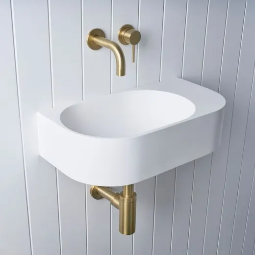 Wall-hung basin with wall mixer, brushed brass