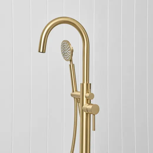 Freestanding bath spout with hand shower, brushed brass